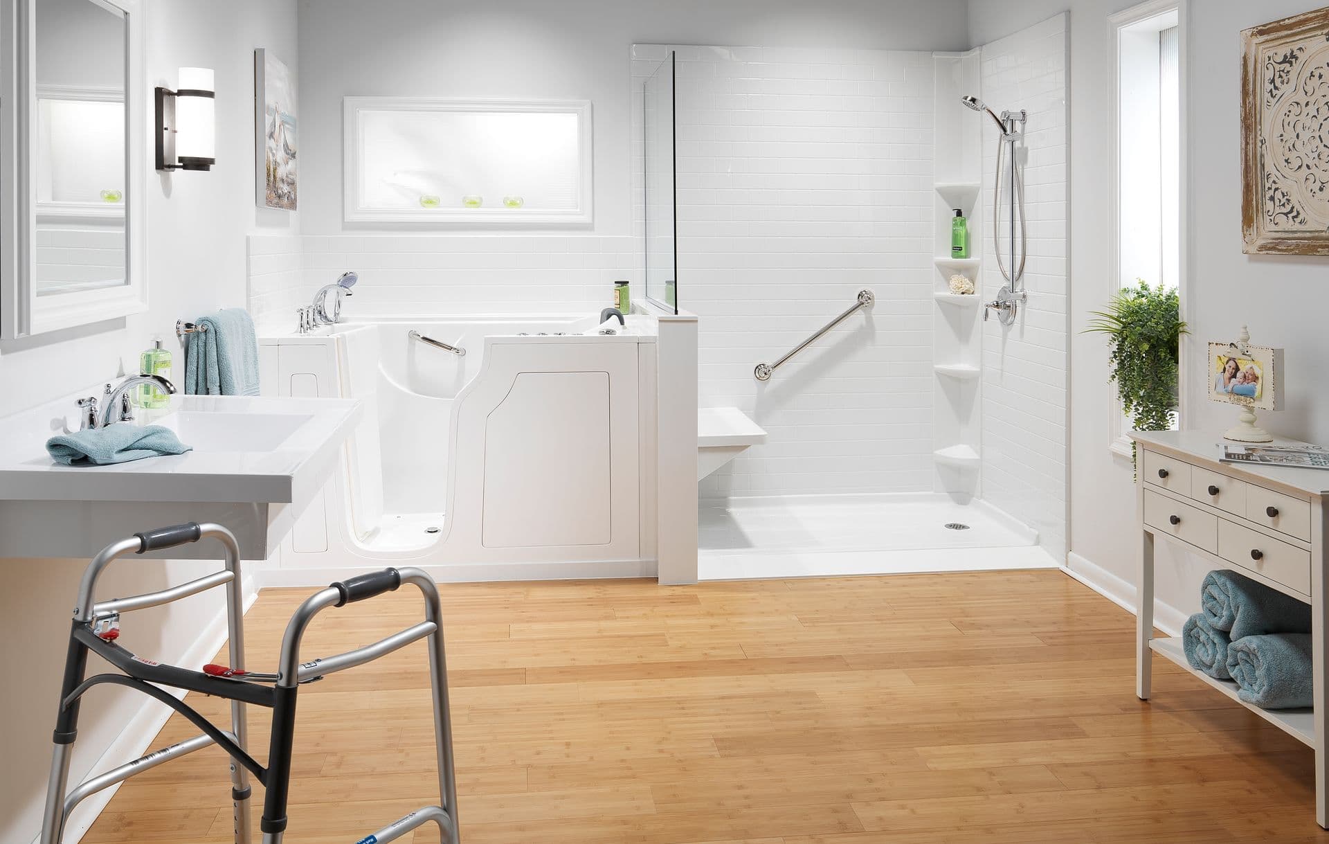 Accessible bathroom featuring a walk-in bathtub, barrier-free shower with grab bars and built-in bench, white subway tile surround, wood flooring, and a walker for enhanced mobility and safety.