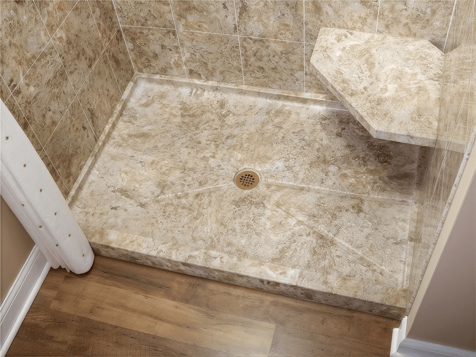 Low-threshold walk-in shower with a stone-look shower base, matching wall surround, built-in corner bench, center drain, and durable, easy-to-maintain finishes designed for comfort and accessibility.
