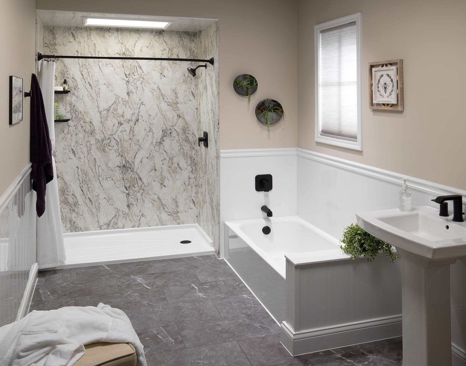Bathroom with a marble-look walk-in shower, white alcove bathtub, pedestal sink, black fixtures, and gray stone-look tile flooring.